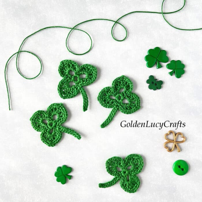 Crochet shamrock appliques for St. Patrick's Day, decorative shamrock buttons.