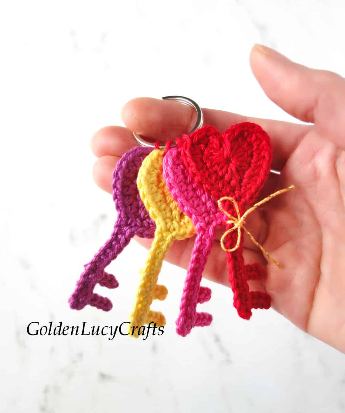 Bunch of multi-colored crochet heart keys.