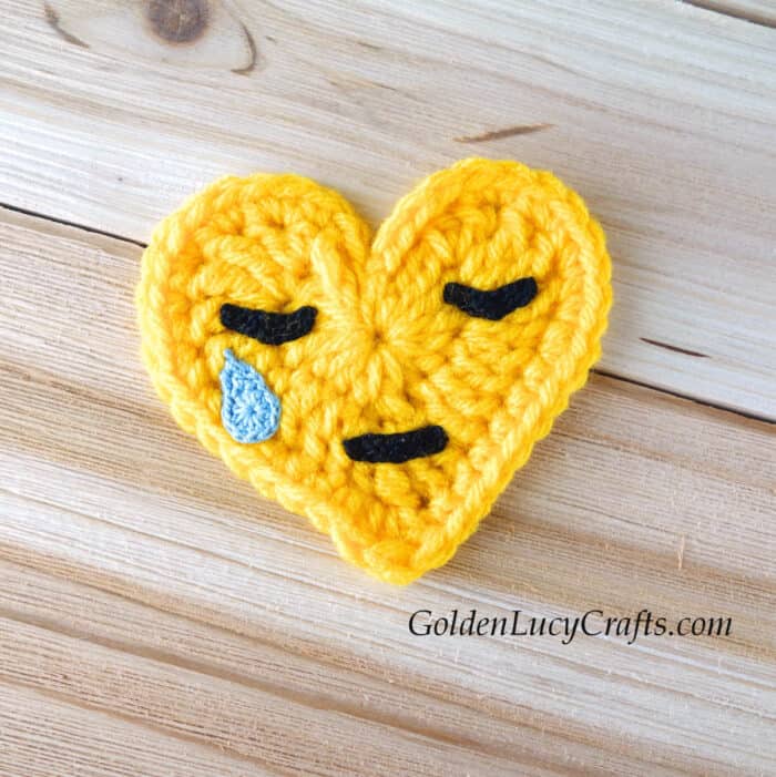 Crying face crochet heart emoji.