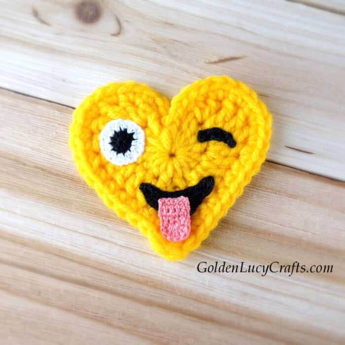 Crocheted heart-shaped emoji crazy face.