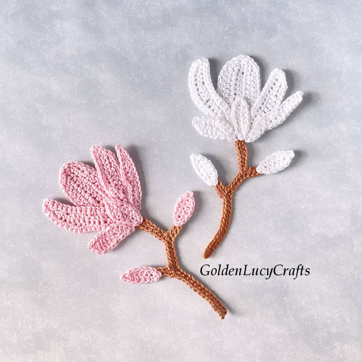 White and pink crocheted magnolia appliques.