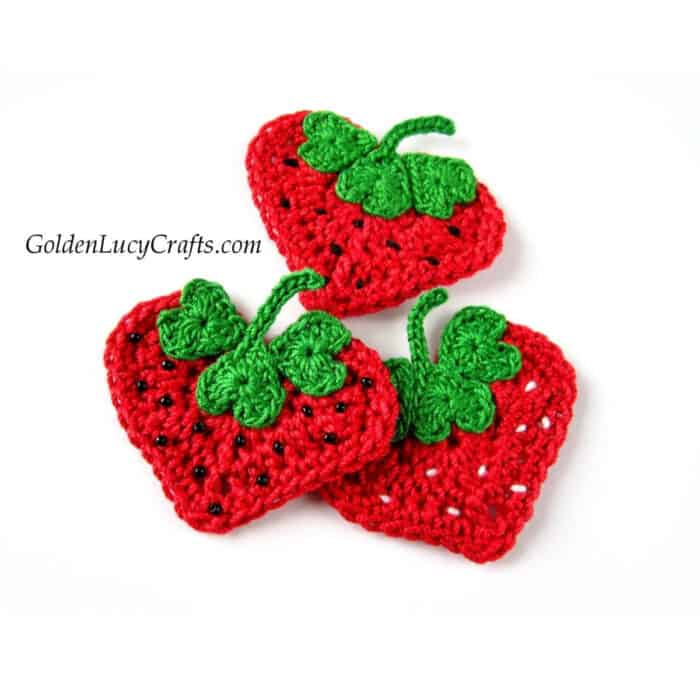 Crochet strawberry appliques made from hearts.