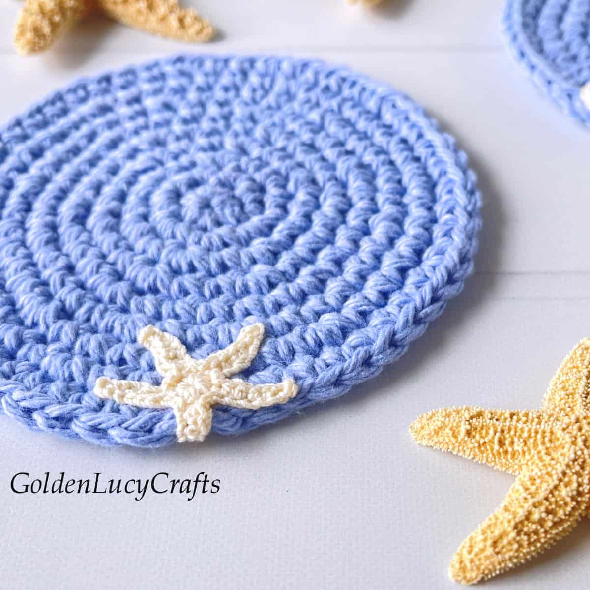 Crocheted coaster embellished with sea star applique.