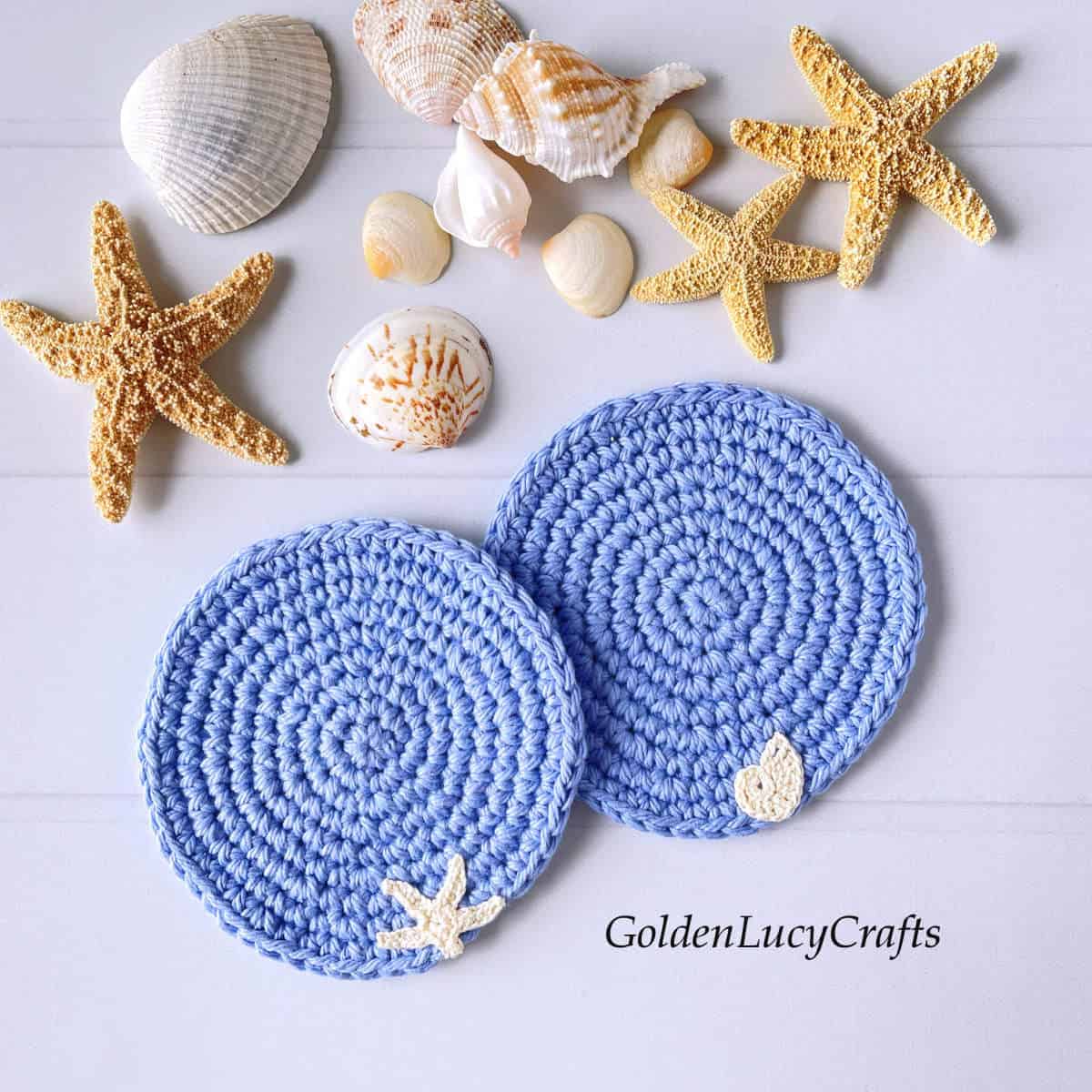 Crocheted ocean themed blue coasters, sea stars and sea shells.