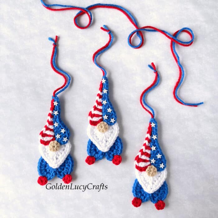 Crocheted heart-shaped patriotic gnomes.