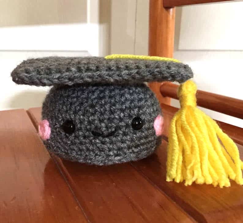 Crochet grey graduation cap amigurumi.