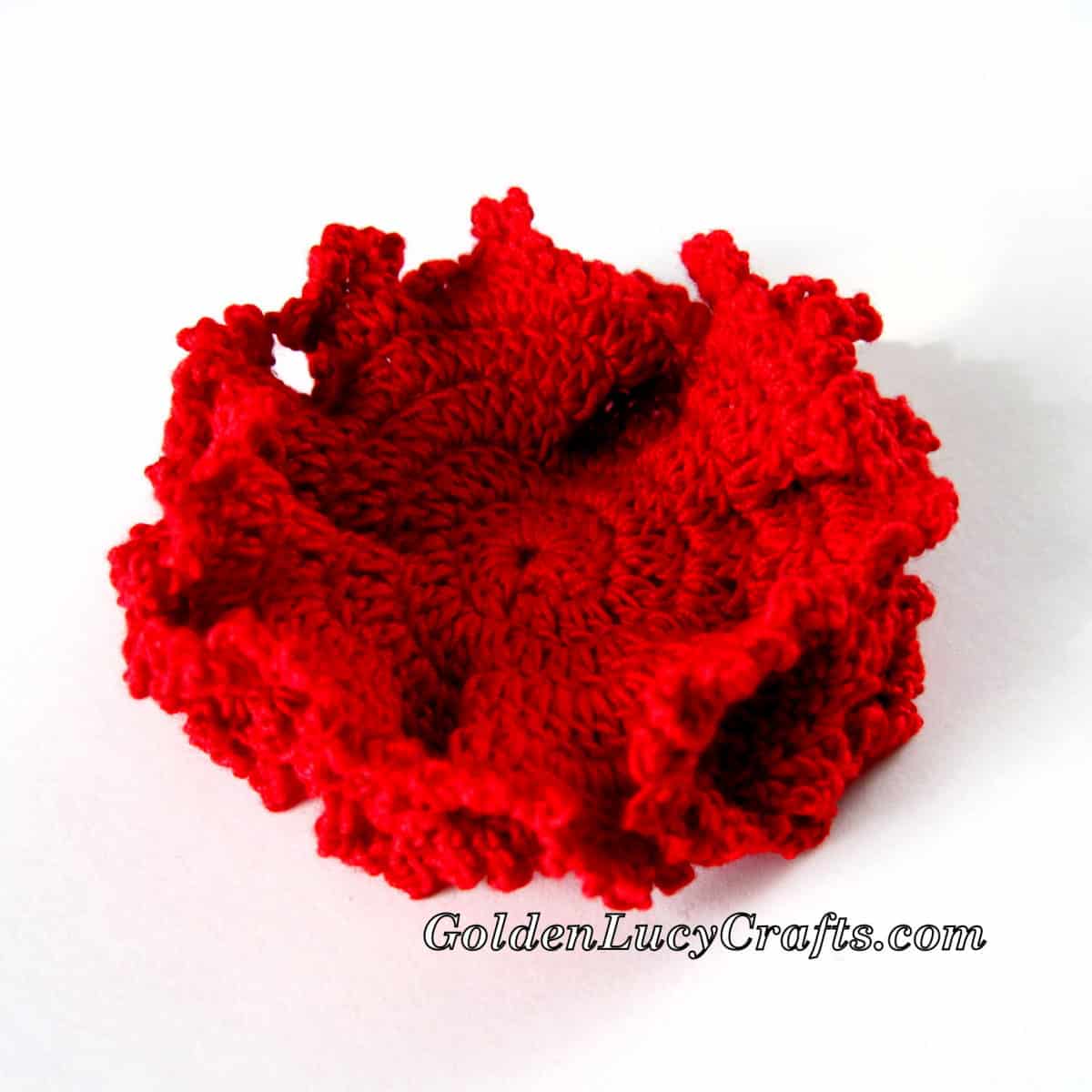 Crochet hyperbolic coral in red color.
