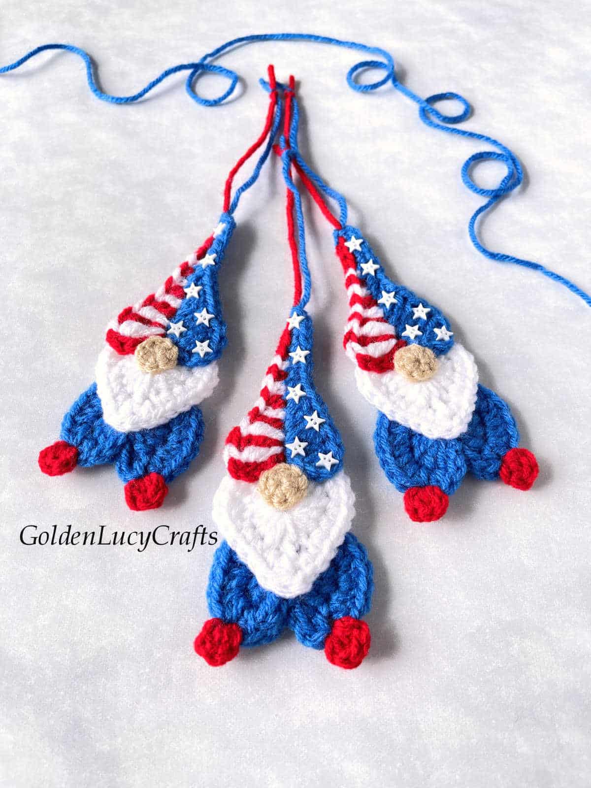 Three crochet patriotic gnome ornaments.