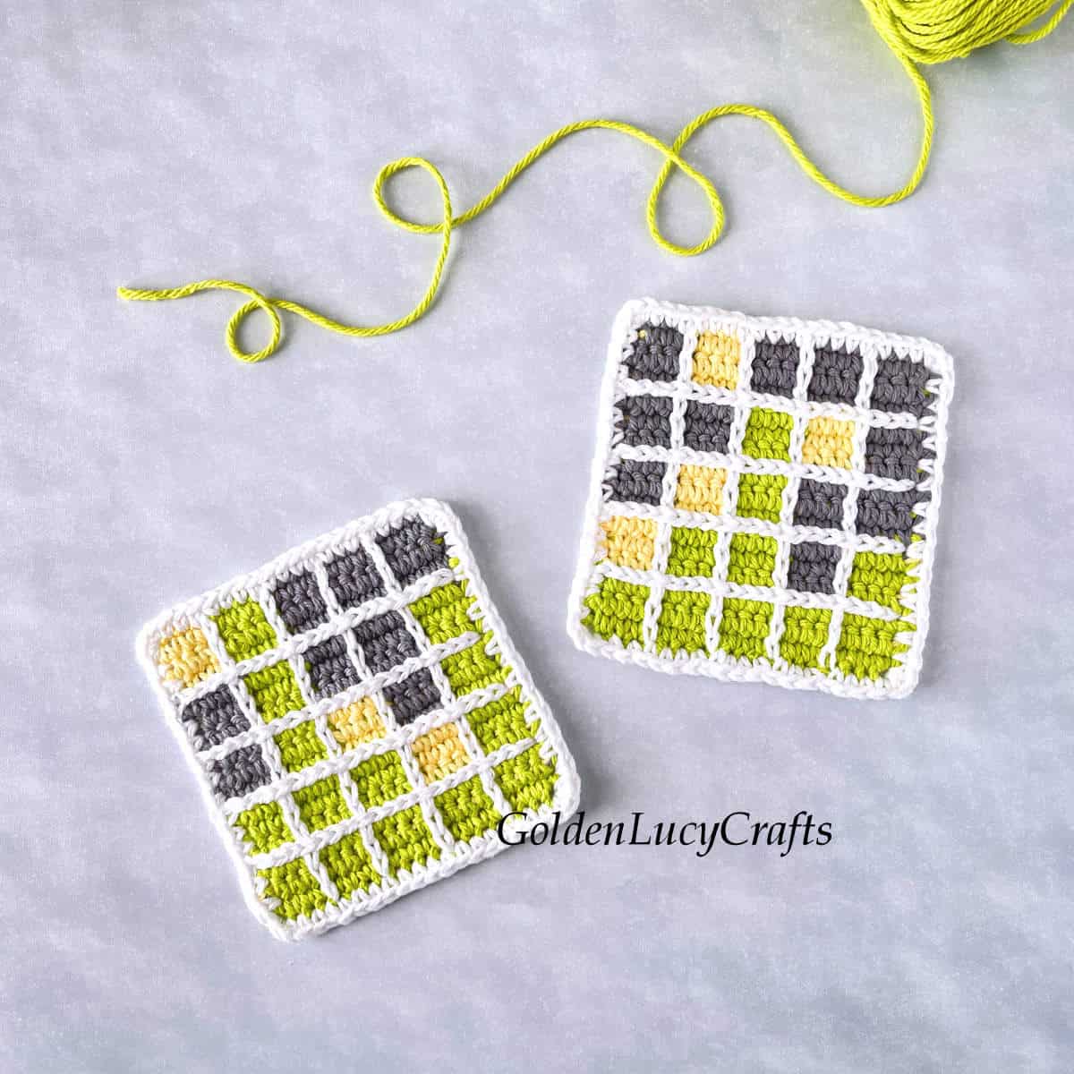 Crocheted square coasters wordle game.