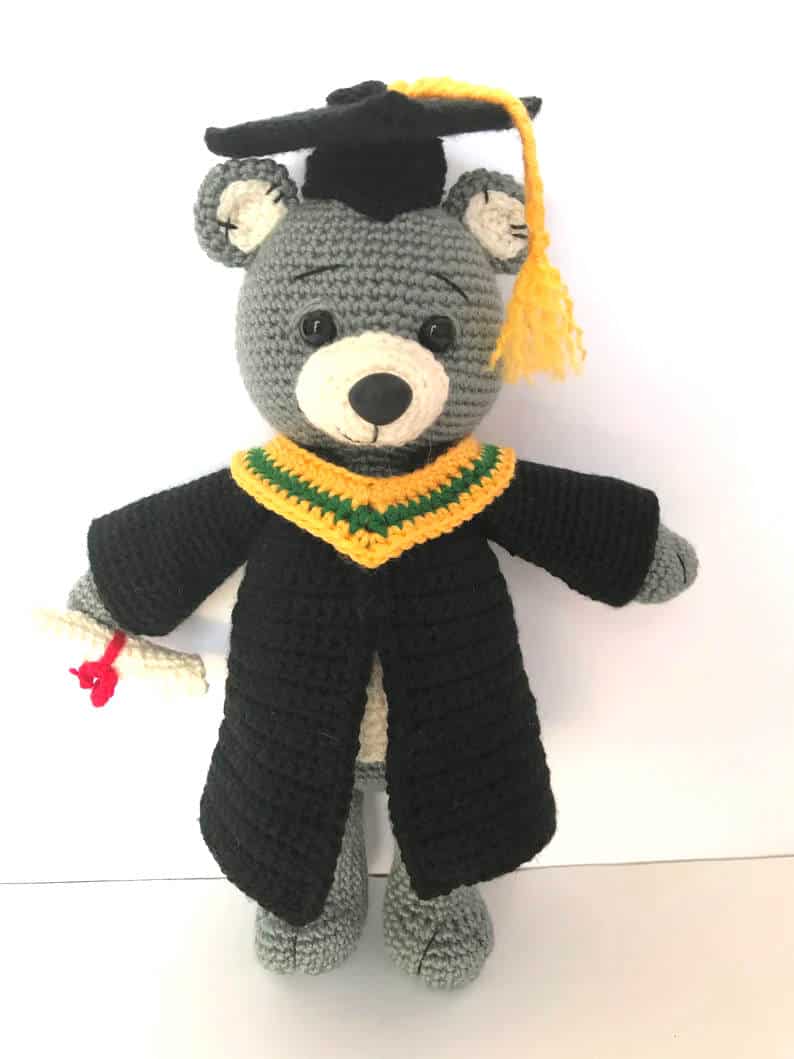 Crochet graduation bear toy.
