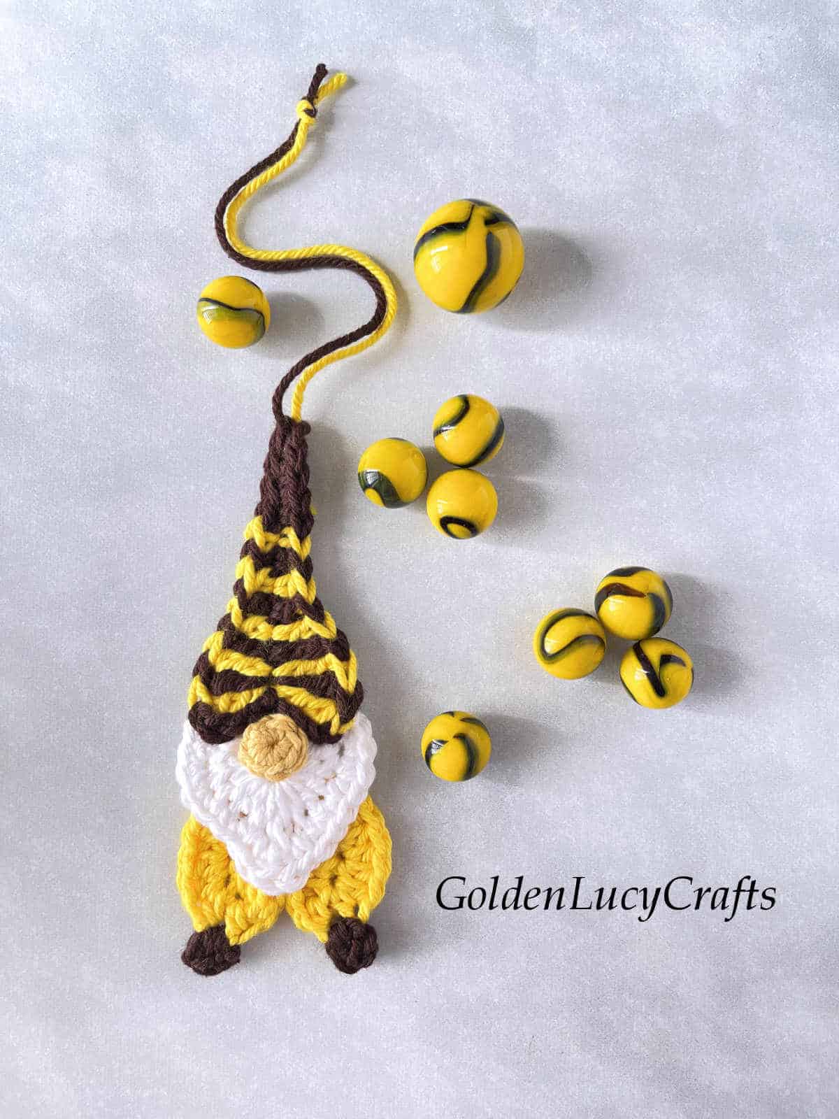 Crocheted bee gnome ornament made from hearts.