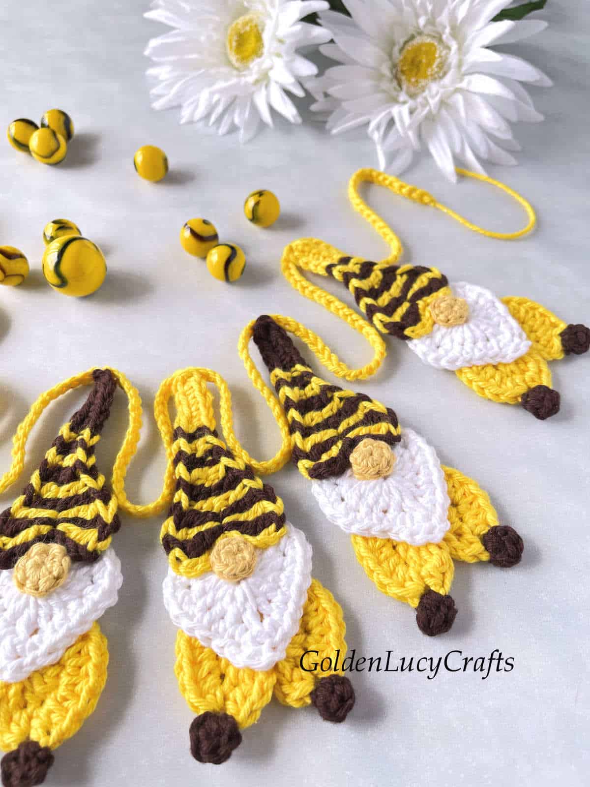 Close up picture of crochet bee gnome garland.