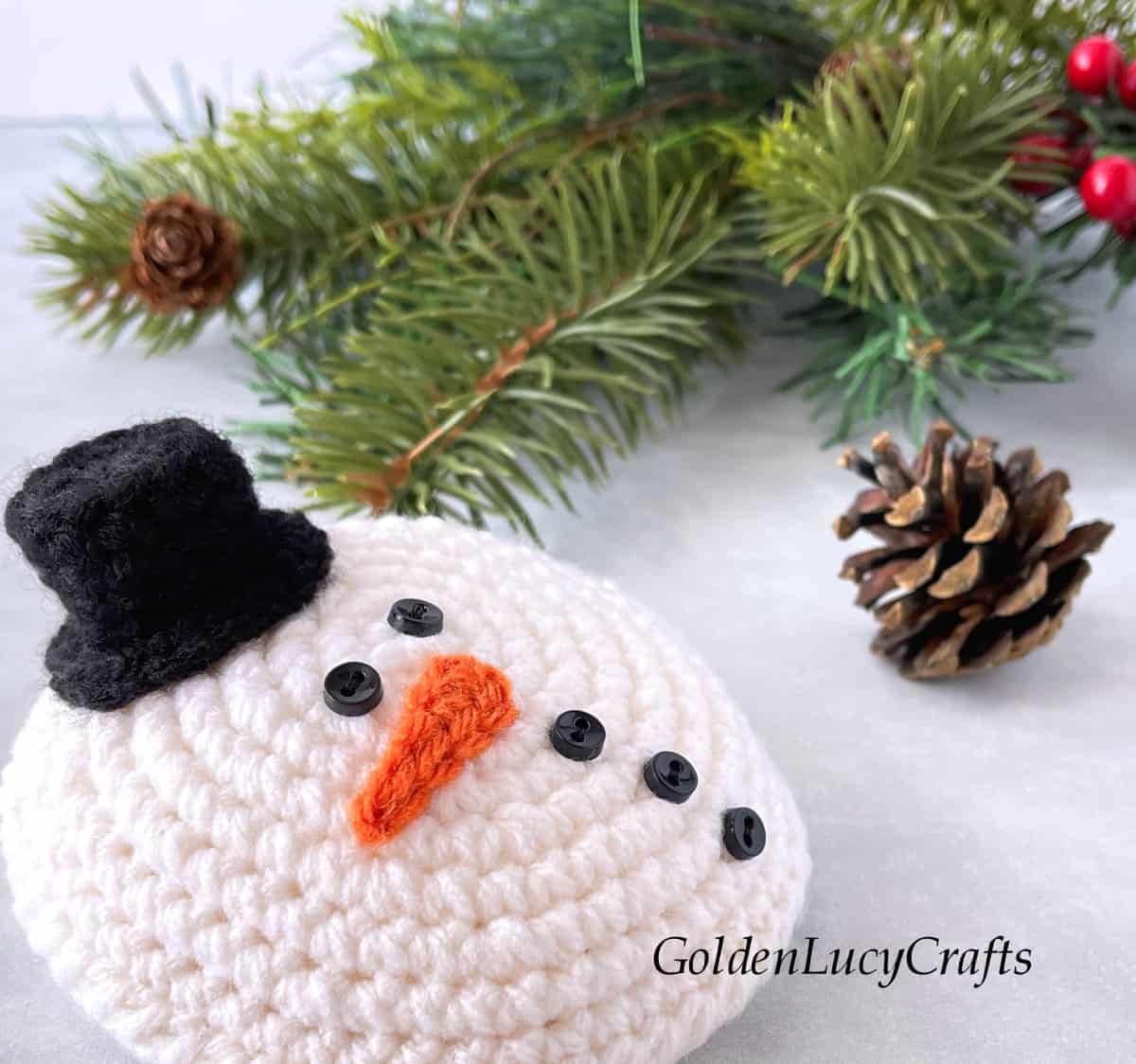 Crochet melted snowman close up picture.