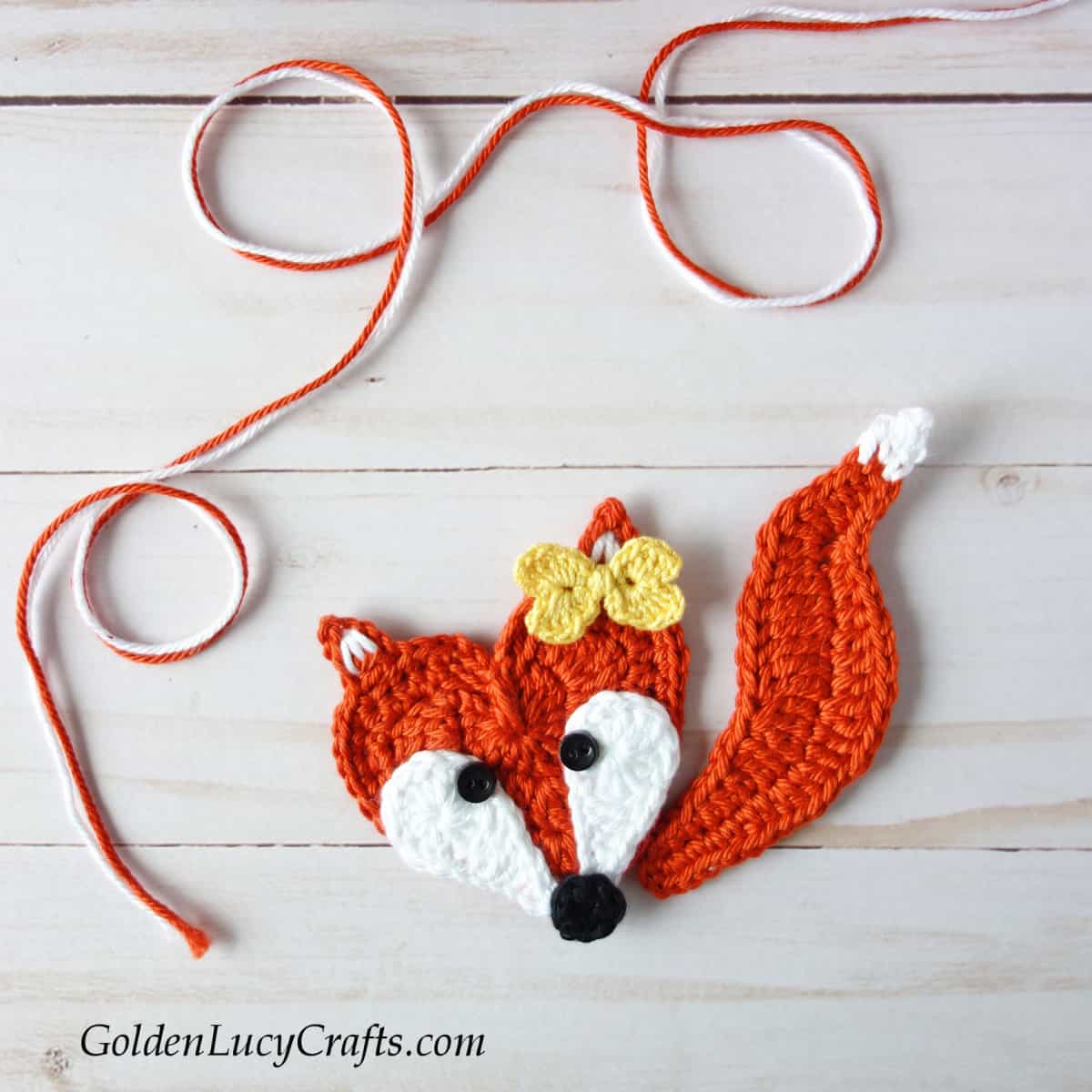Fox with small yellow bow crochet applique.