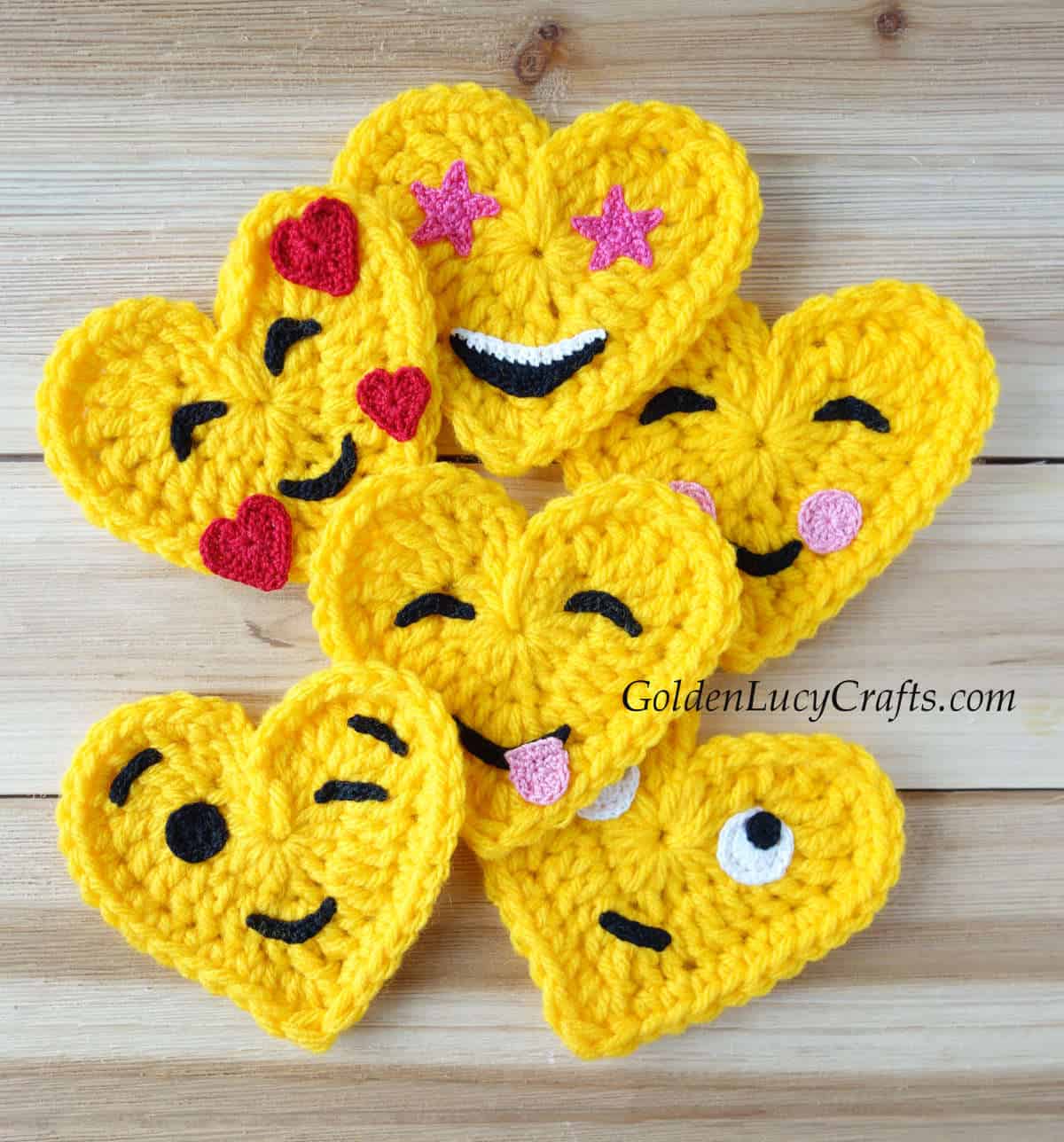 Six crocheted heart-shaped emojis.