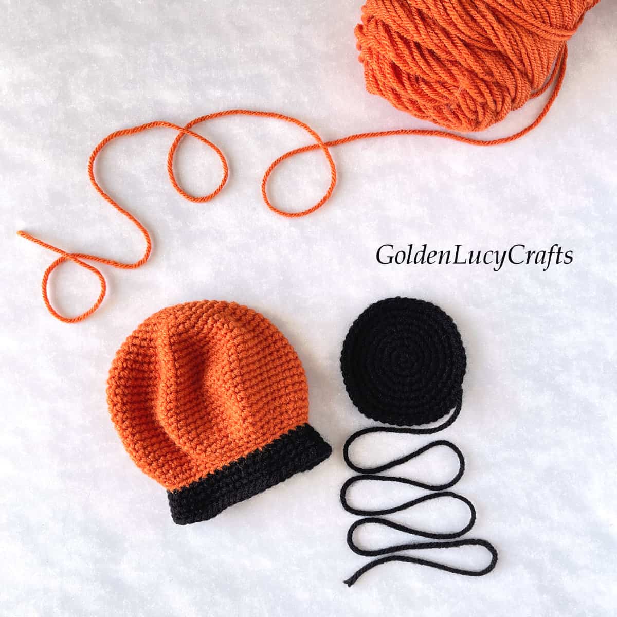 Process shot of crocheting pumpking snow globe.