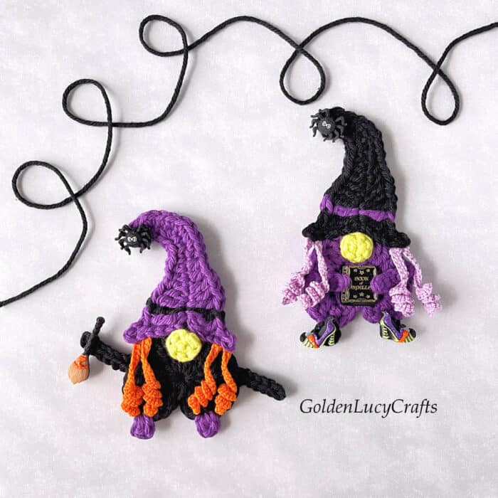 Two crochet witch appliques.