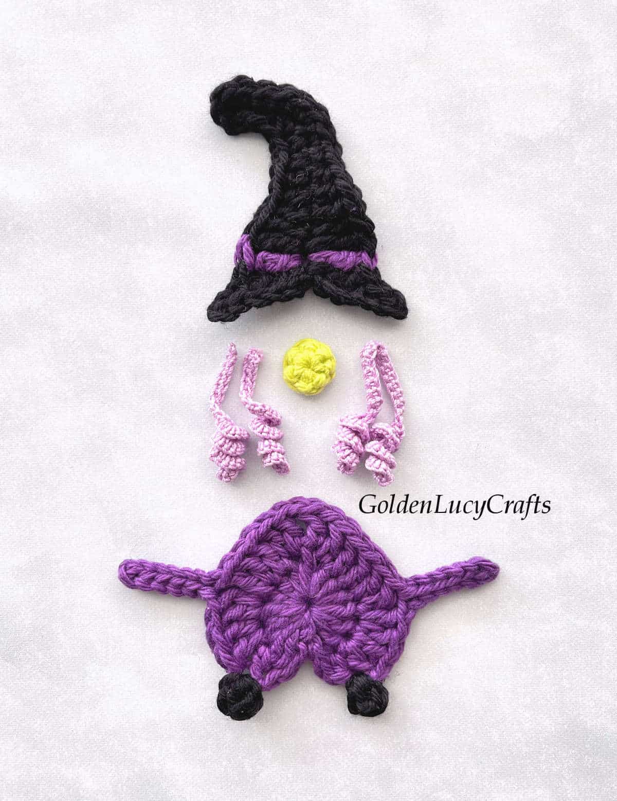 Elements of crocheted witch applique.