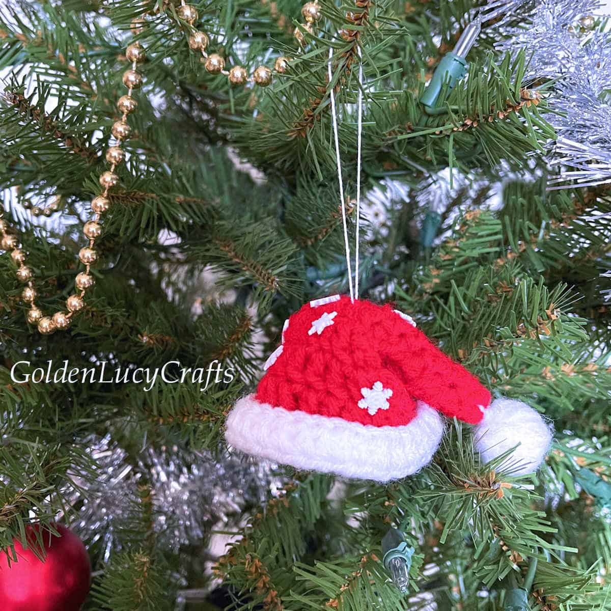 Crochet Santa hat Christmas tree ornament.
