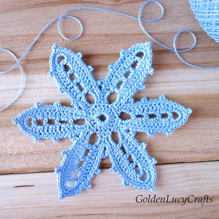 Crochet Irish lace flower in light blue.
