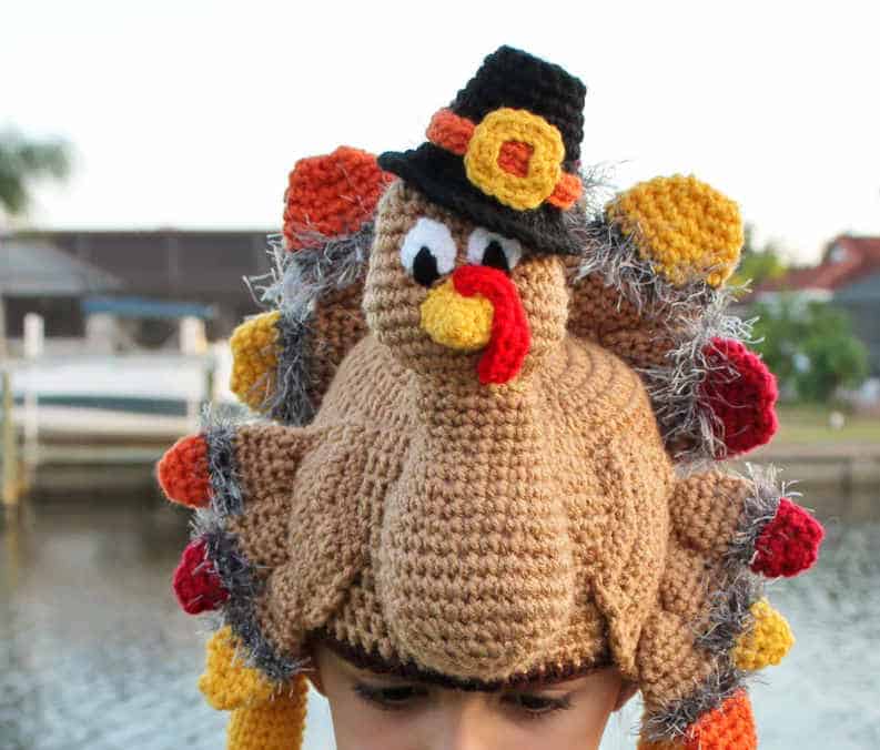 Child dressed in turkey hat.