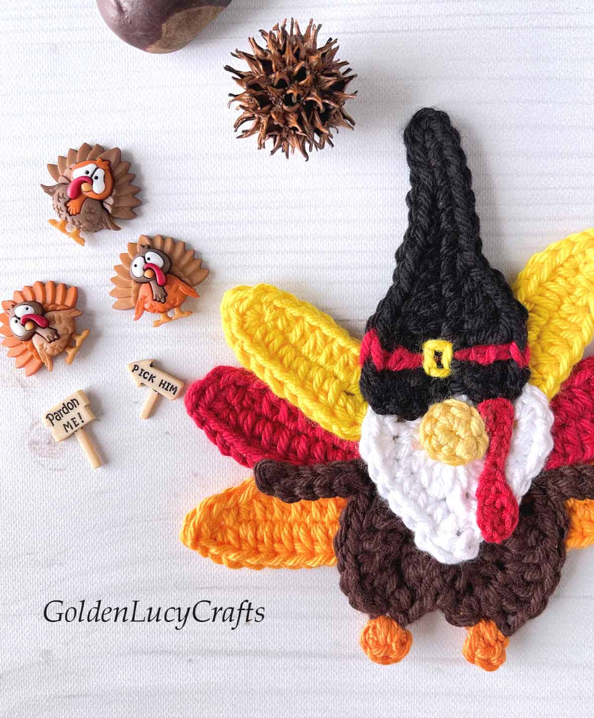 Crochet turkey gnome and decorative buttons - close up picture.