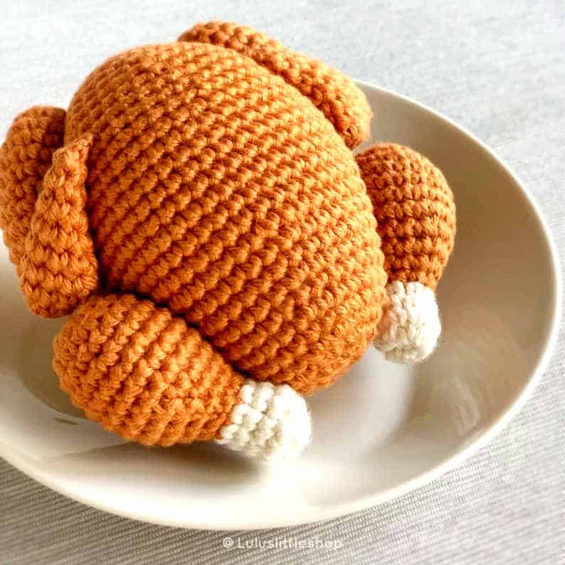 Crochet roasted turkey on a plate.