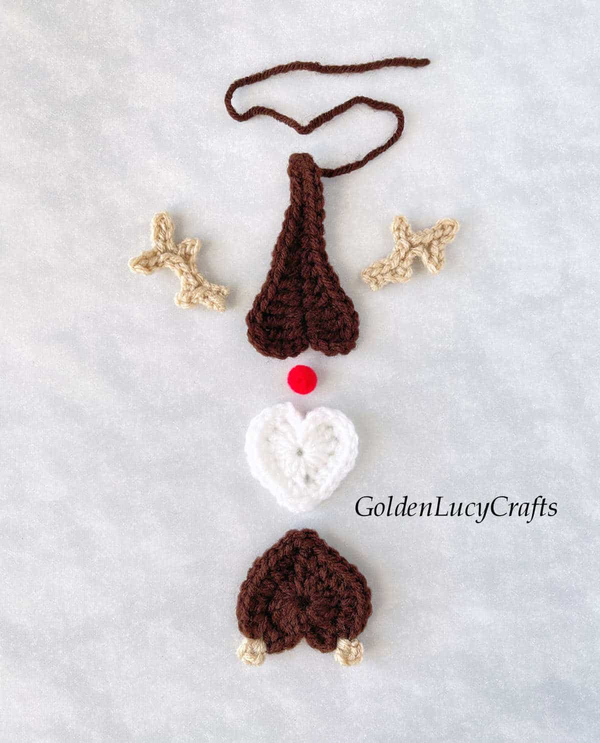 Parts of crochet reindeer gnome.