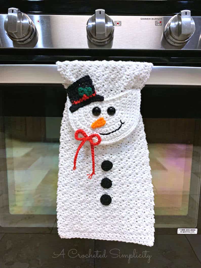 Crochet snowman kitchen towel.