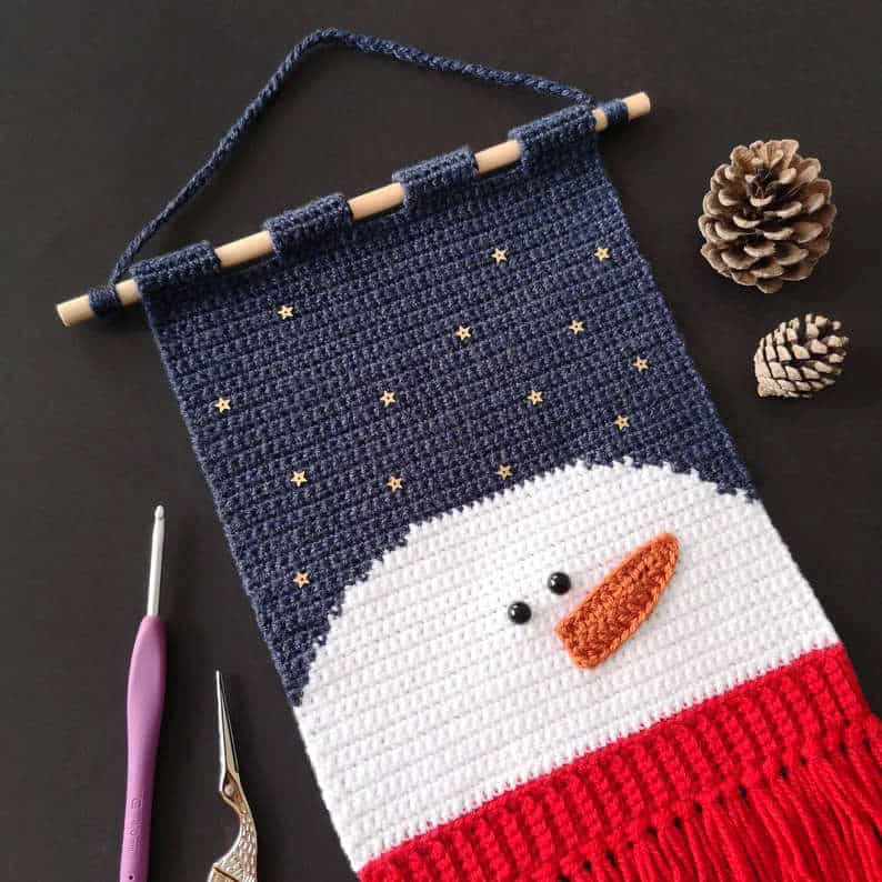 Crochet snowman wall hanging.