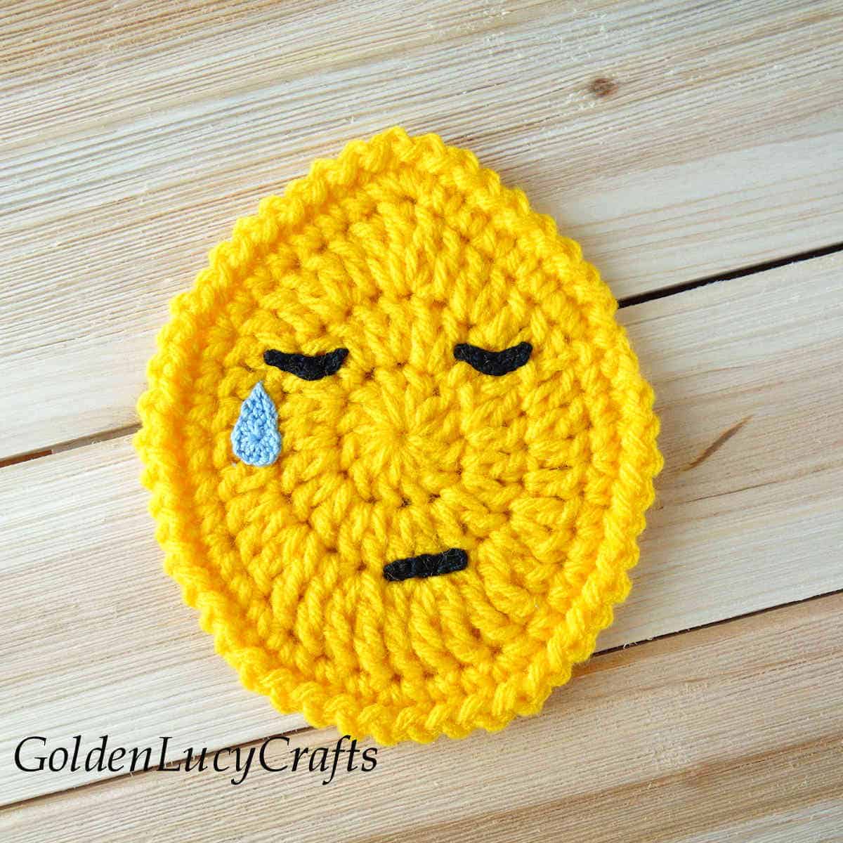 Crochet Easter egg emoji crying face.