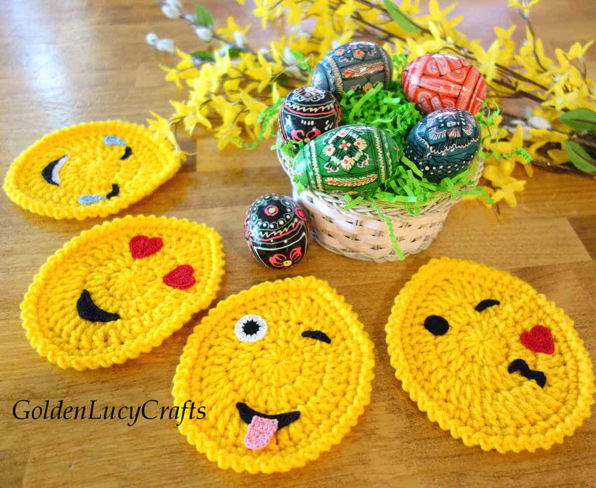 Crochet Easter egg emoji coasters, painted wooden eggs.