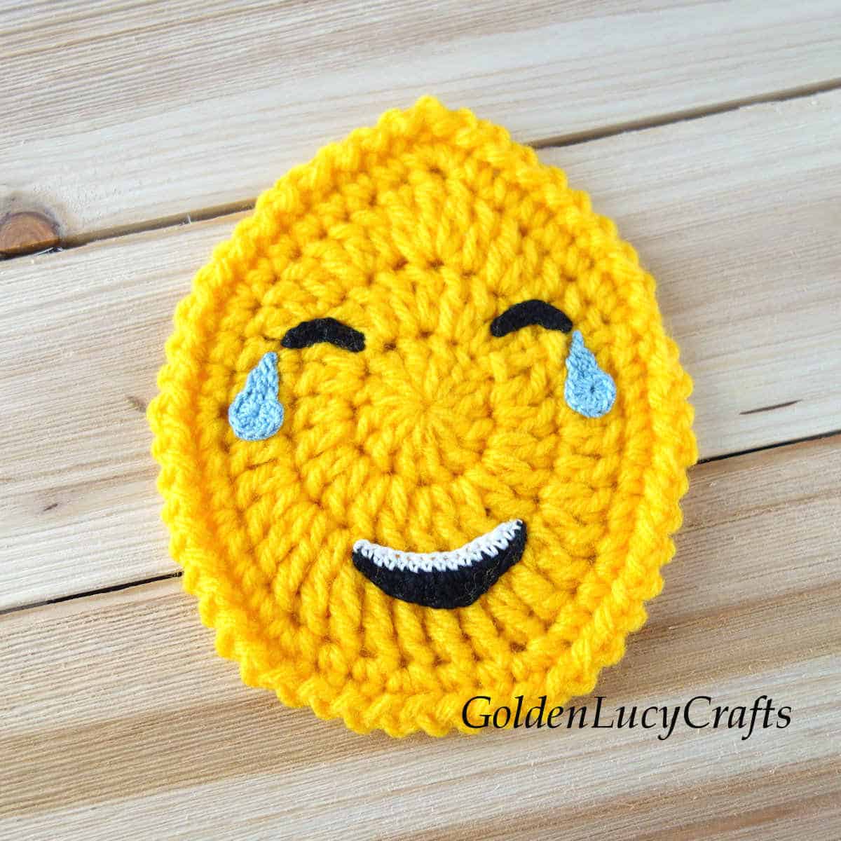 Crochet Easter egg emoji tears of joy.