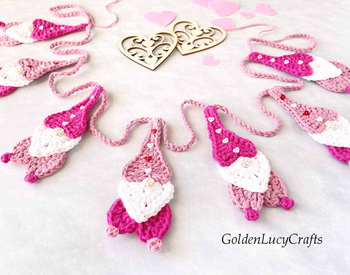 Crocheted garland for Valentine's Day made from heart gnomes.