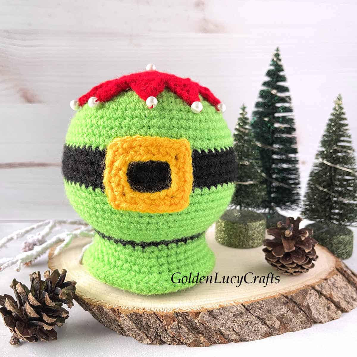 Crochet elf belly snow globe.