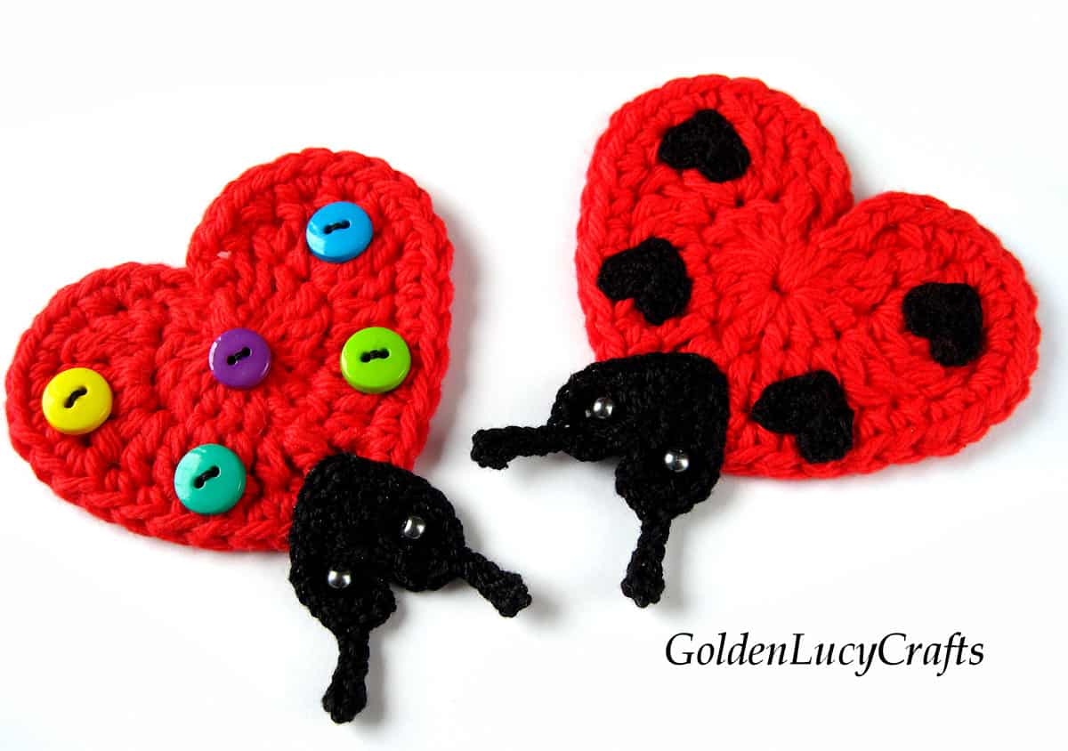 Two crocheted ladybugs made from hearts.