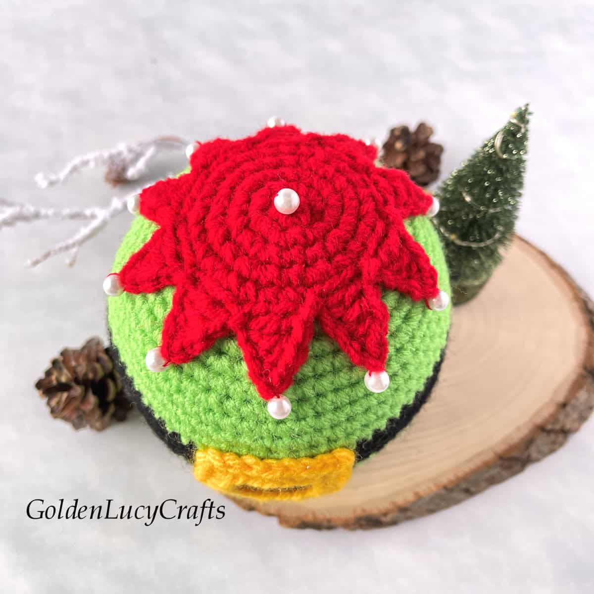 Crochet elf belly snow globe view from above.