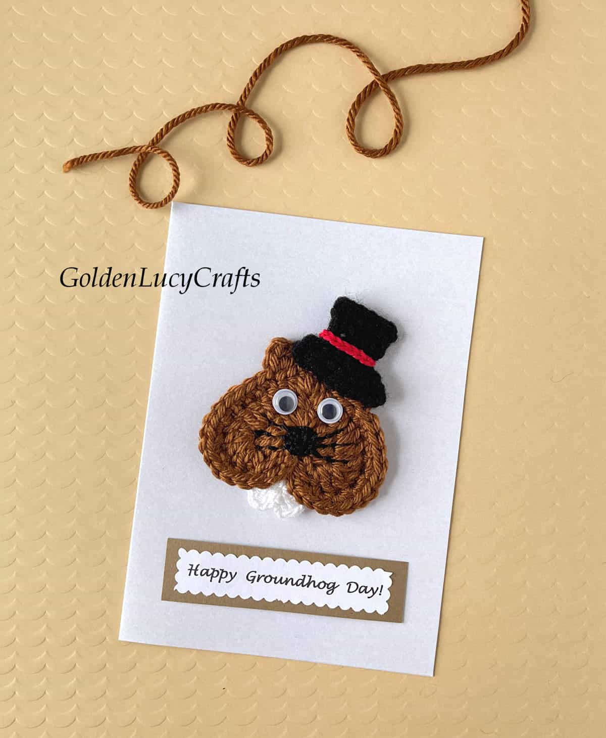 Crochet groundhog applique on white card, note saying "Happy Groundhog Day!"