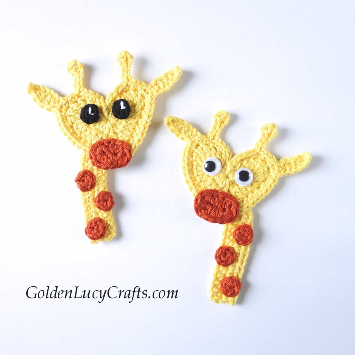 Two crocheted heart-shaped giraffes.