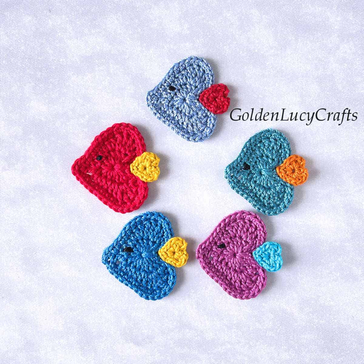 Five crochet fish appliques.