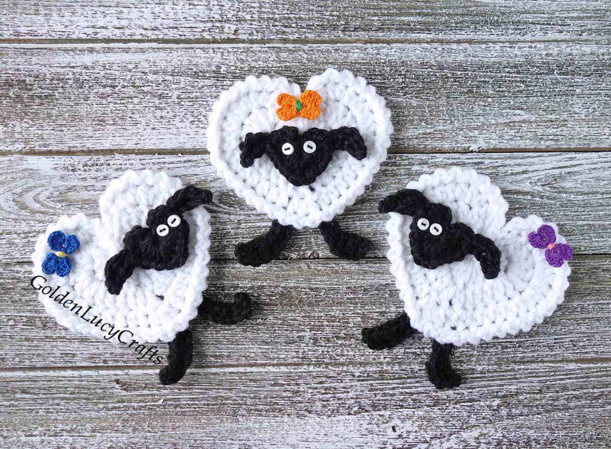 Three heart sheep with bows crochet appliques.