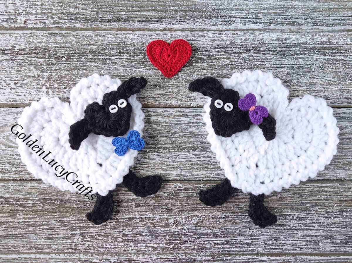 Two crochet sheep and a red heart above them.