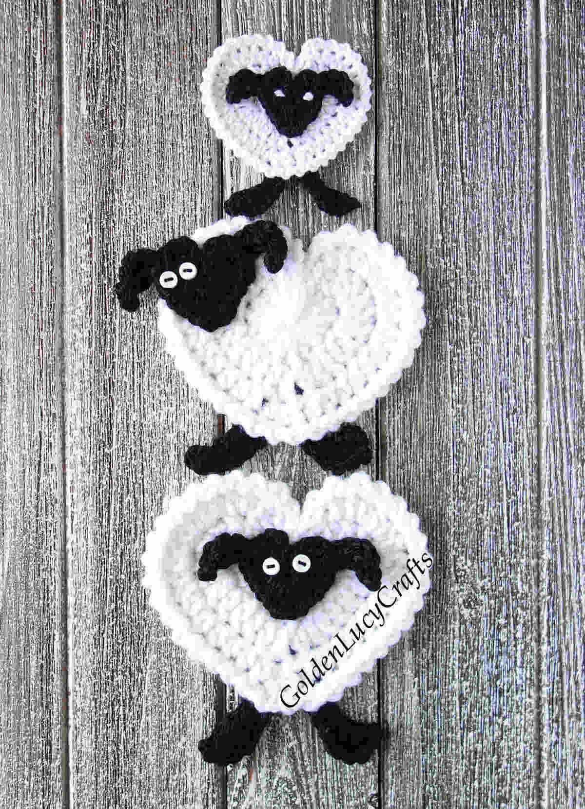Three crochet sheep appliques placed on top of each other.
