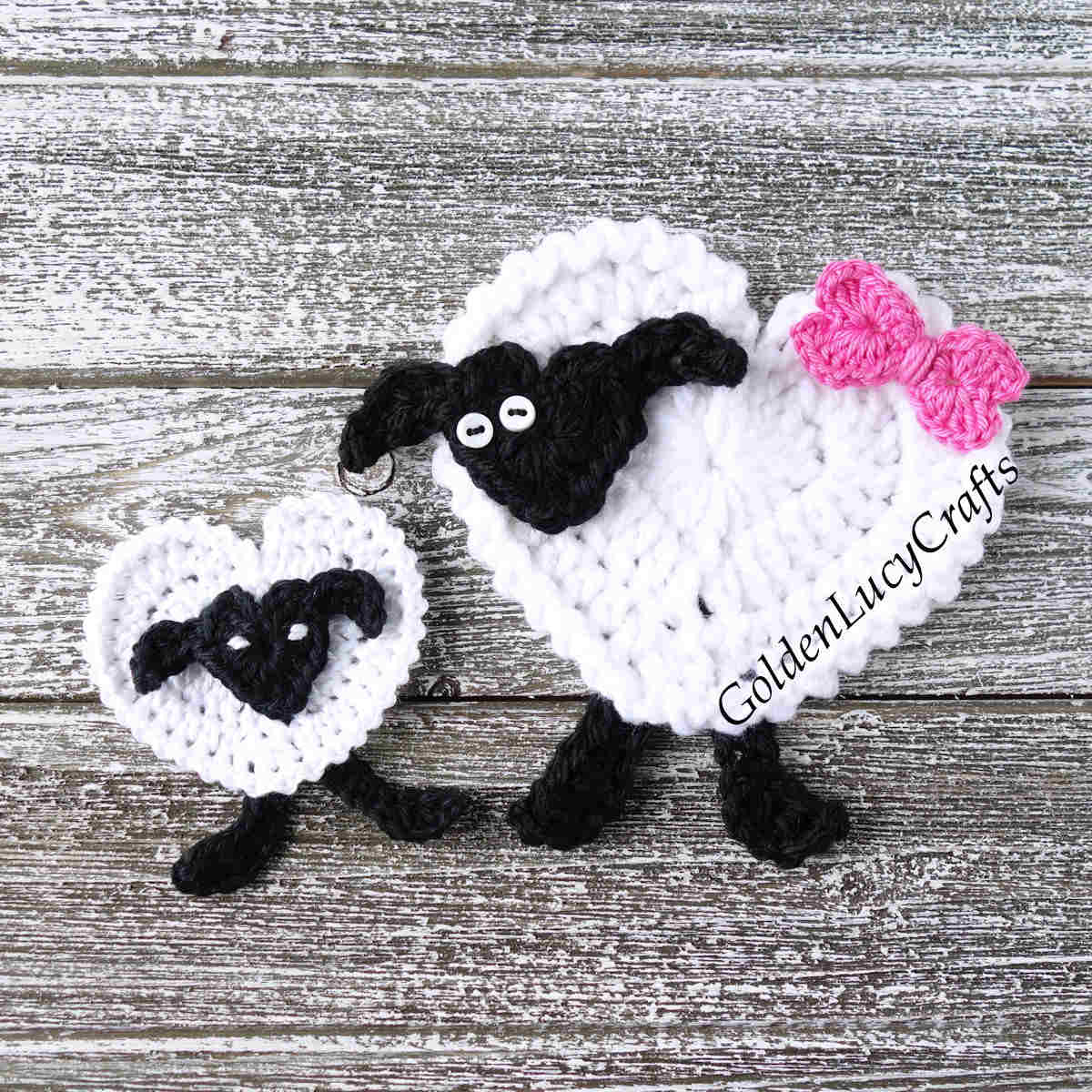 Two crocheted sheep appliques.