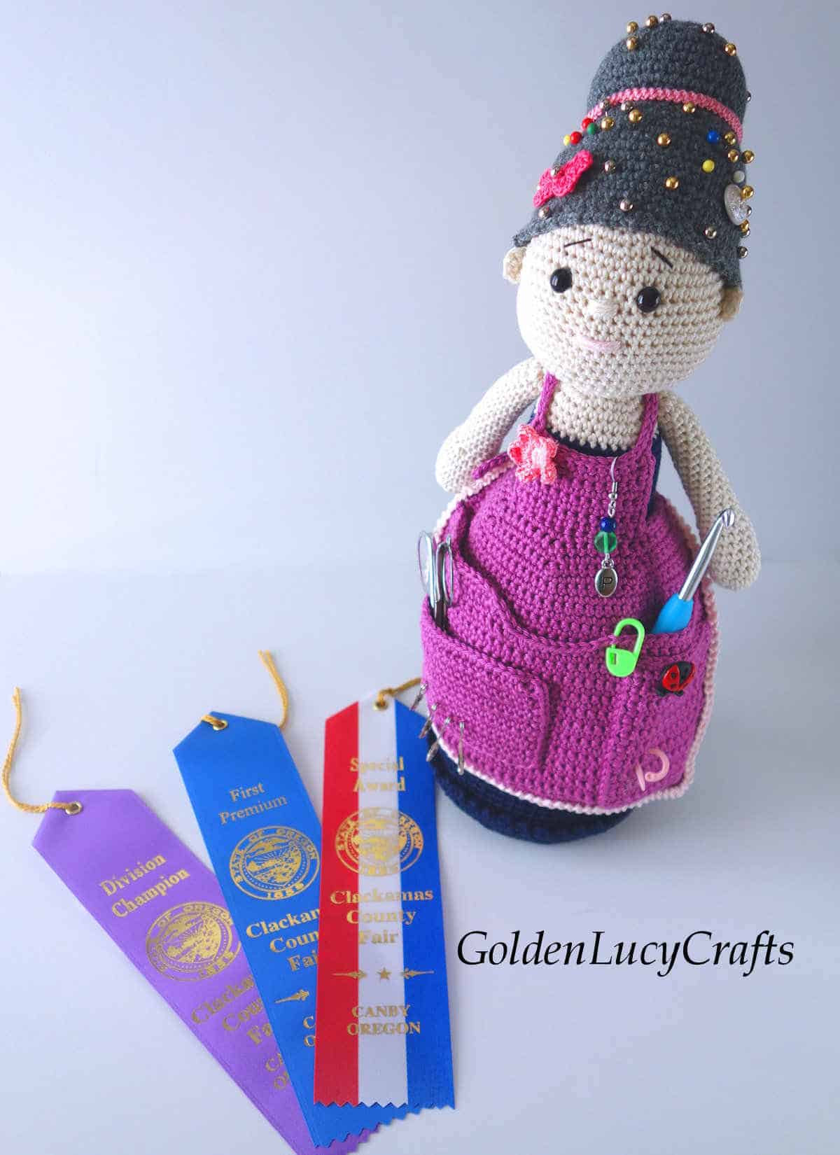 Crochet crafter granny doll and three ribbons.