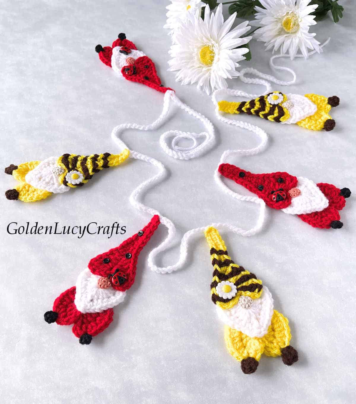 Crochet garland - bee and ladybug gnomes.