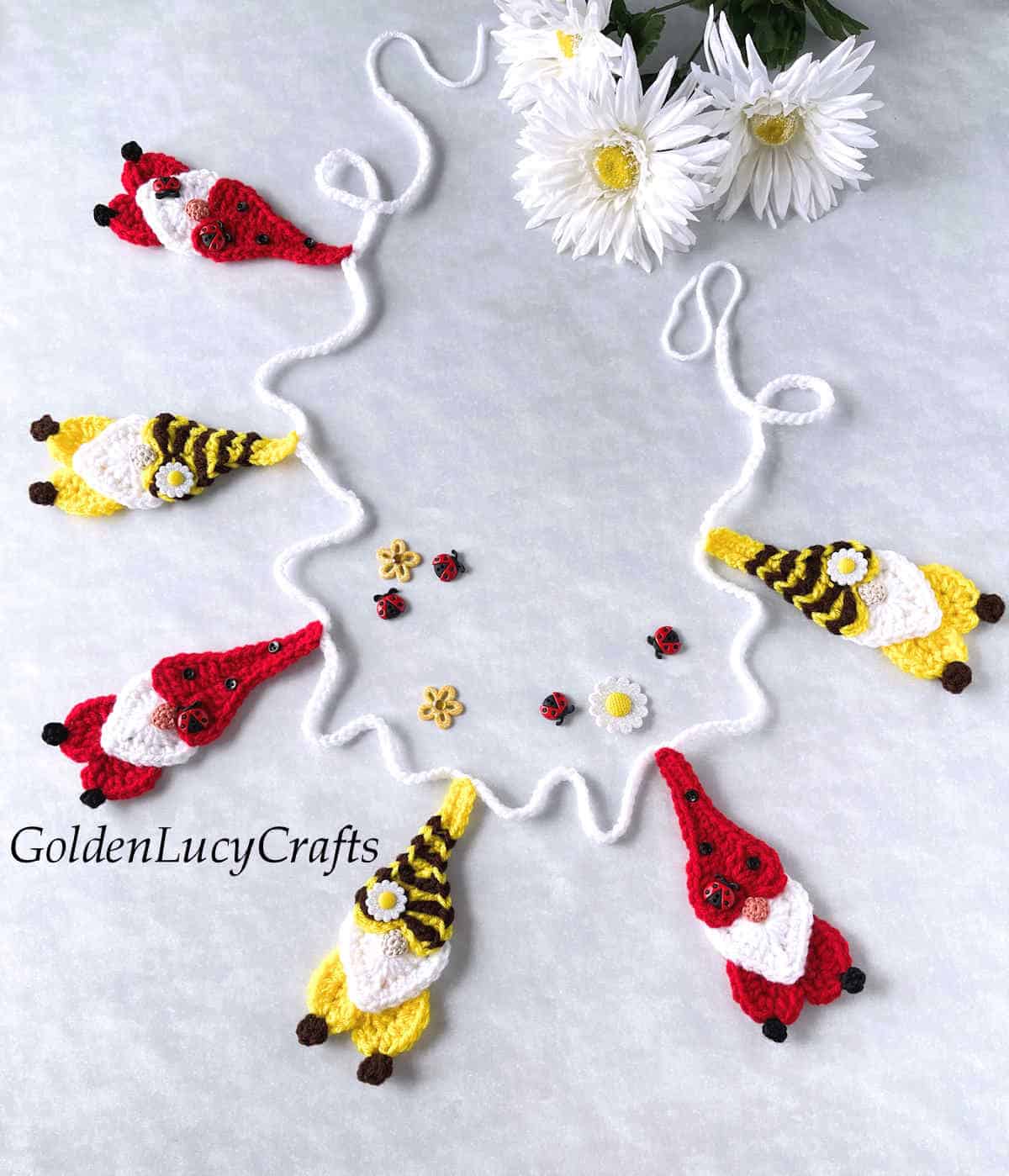 Crochet bee and ladybug gnomes garland.