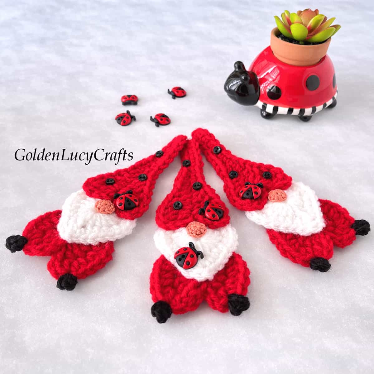 Three crochet ladybug gnomes.