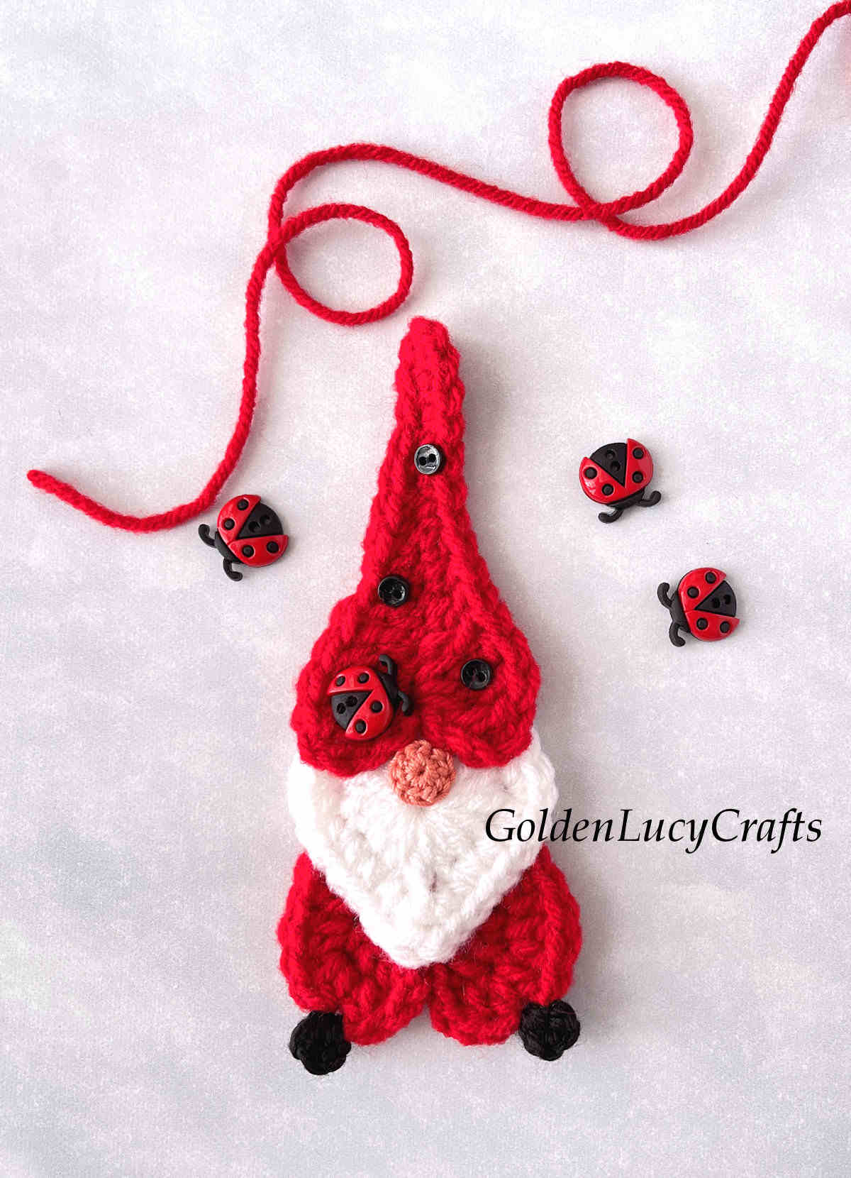 Crocheted ladybug gnome applique.