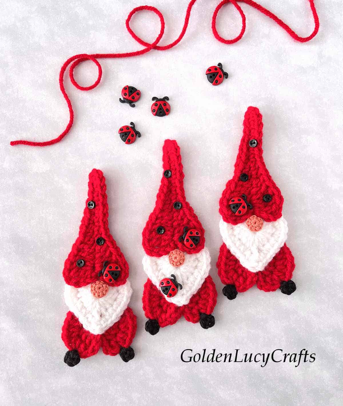 Three crochet ladybug gnome appliques.